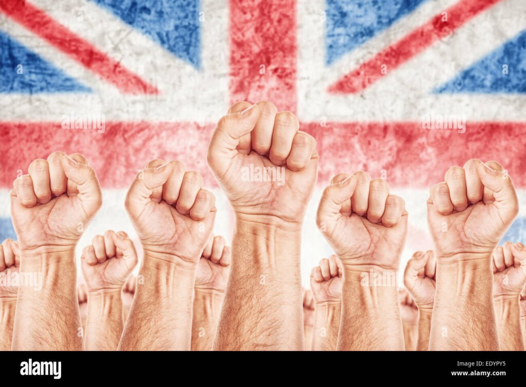 tyovaenliikkeen lakon symboli nyrkki ja lippu